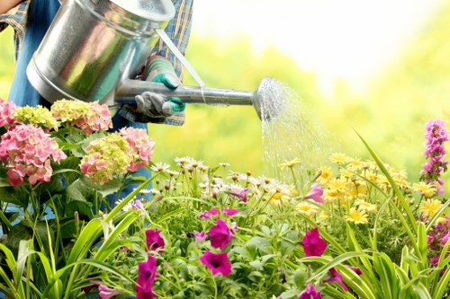 Gardener preparing to provide a free on-site hedge trimming quote